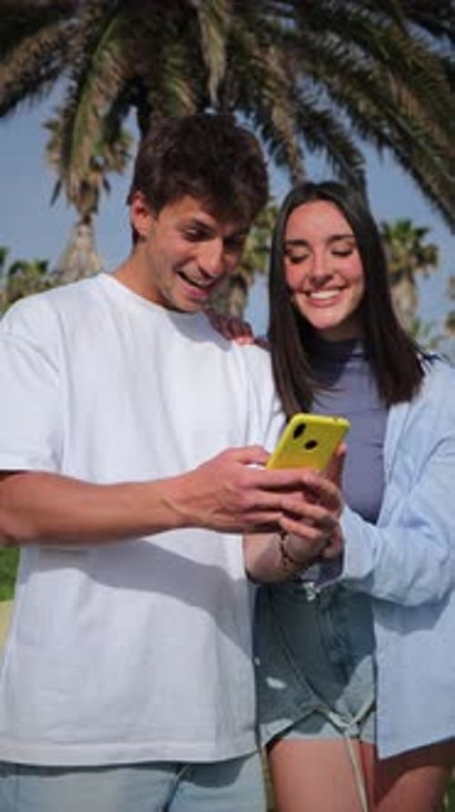 Couple Enjoying Phone Together, Tropical Background
