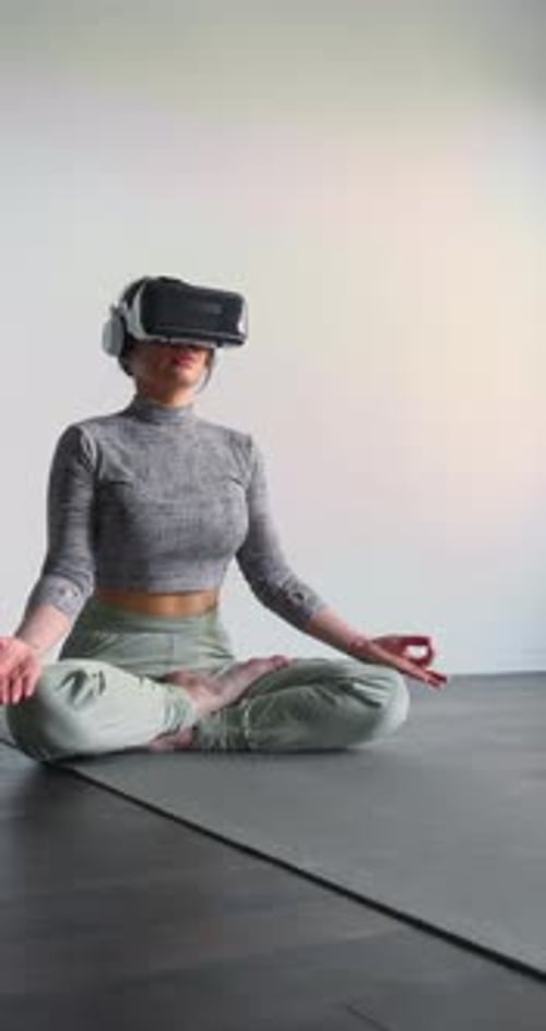 Woman Meditating in VR Headset on Yoga Mat