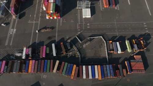 Logistics and Transportation of Container Cargo Ship with Working Crane Bridge in Shipyard