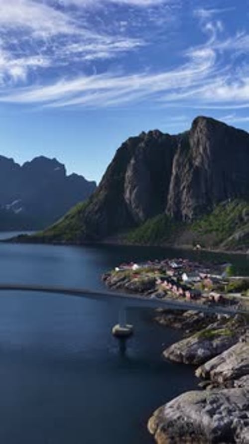 Scenic Aerial View of Reinebringen Mountain and a Fishing Village