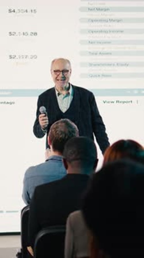 Business Presentation by Mature Man to Audience