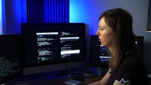 Fast computer programmer. A female code engineer programming artificial intelligence language models