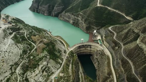 A Dam to Control the Water Level in the Mountain Landscape Aerial Photography of Mountain Rivers