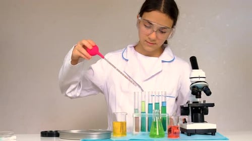 Girl Experimenting With Chemicals in Science Lab