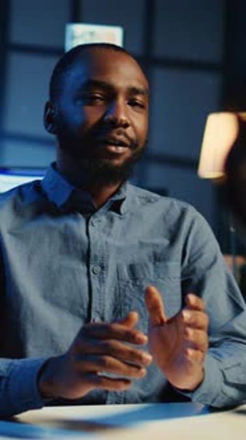 Young Adult Man Talking in Studio at Night