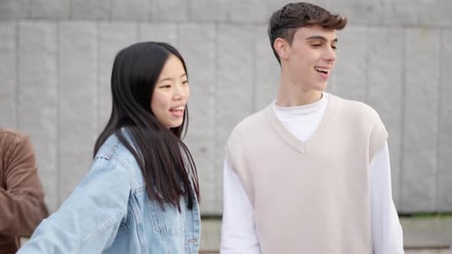 Group of Young Multiethnic Friends Listening to Music and Dancing