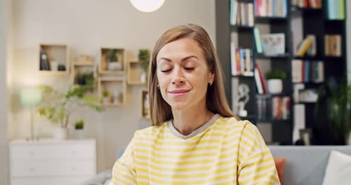 Attractive Woman Smiling Indoors In Her Living Room