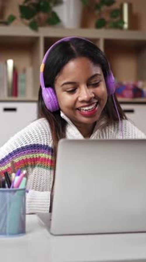 Cheerful Woman Video Conferencing With Laptop at Home