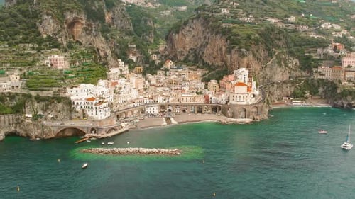 Aerial view of Atrani town on Amalfi Coast, unique architecture nestled between cliffs and the seren