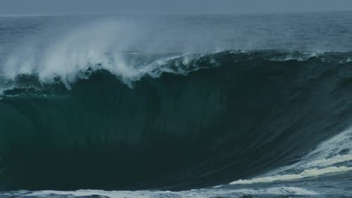Dark Green Wave Folds With Force and Throws Spray, Telephoto Slow Motion
