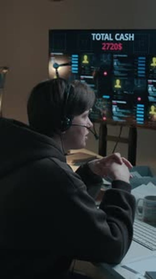 Vertical of Female Scam Call Center Operator Talking on Phone to Victim