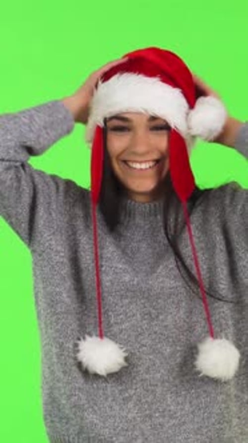 Smiling Woman in Santa Hat on Green Screen