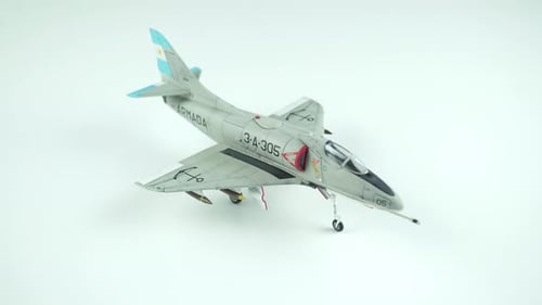 Model Airplane Spinning on White Surface