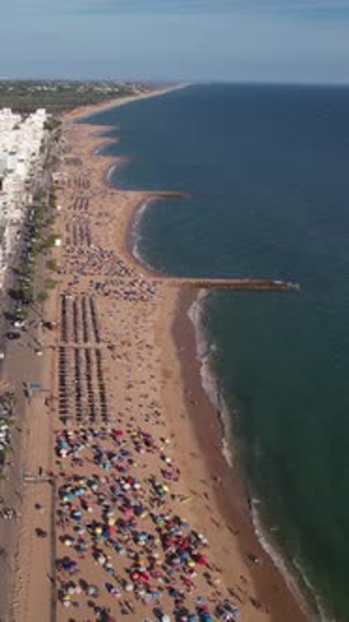 Vertical Video of City and Beach in Quarteira. Algarve, Portugal