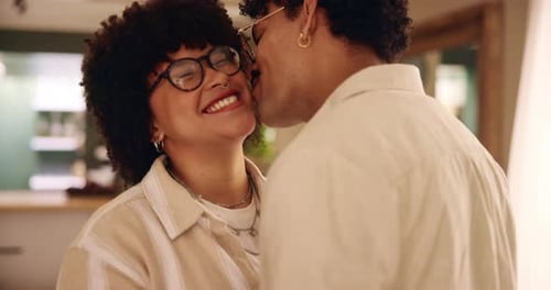 Affectionate Couple Embrace and Kiss in Modern Home