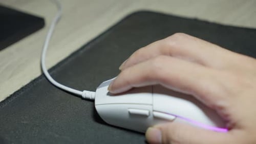 Hand using Computer Mouse with Colorful Lights