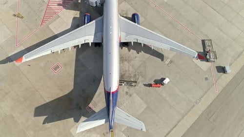 Aerial footage of commercial airline plane in an airport