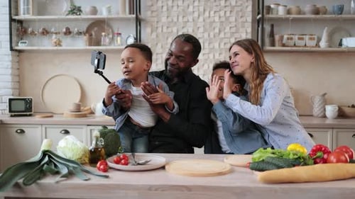 Happy Family Posing for Selfie in Kitchen