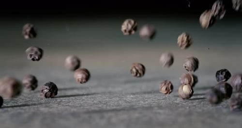 Peppercorns or black pepper spice. Super Macro Close Up. Shot on super slow motion camera 1000 fps.
