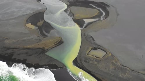 Aerial view of water formation at river estuary and Fjorur beach, Iceland.
