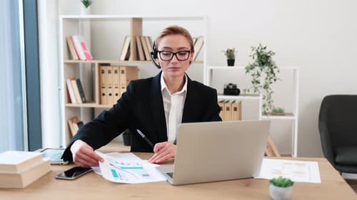 Businesswoman Presenting Financial Report in Office Emphasizes Statistics