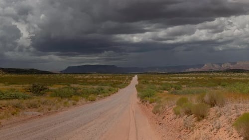 Monsoon Storm Over Dirt Road Wide Shot