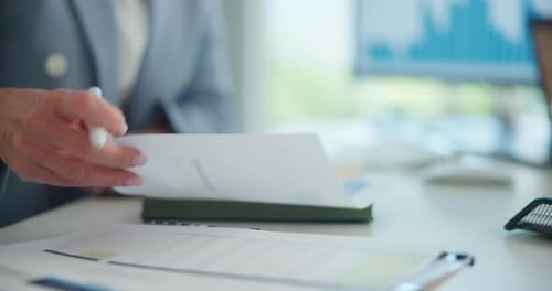 Business woman, hands and paperwork with writing in office for audit, budget accounting and report