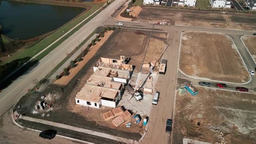 Aerial View the a New House Under Construction Wood Framing Beams at Sunny Day