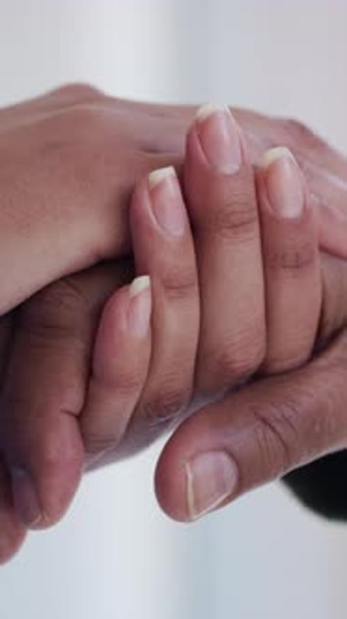 Child and Adult Hands Holding Each Other