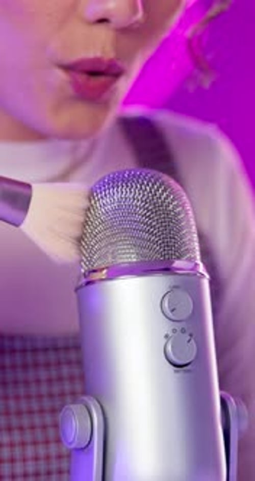 Woman, live streaming and mic in home for social media broadcasting of brush Asmr