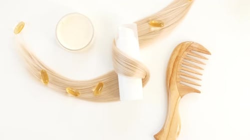 Hair Care Products with Blonde Hair and Comb