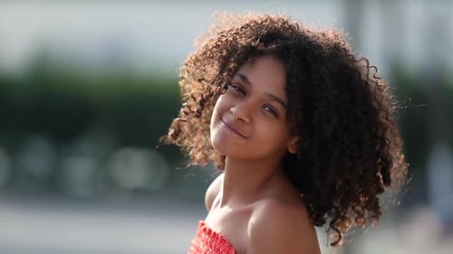 Happy mixed race little girl child smiling portrait face outside