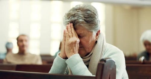 Worship, praying or old woman in church for God, holy spirit or religion in cathedral