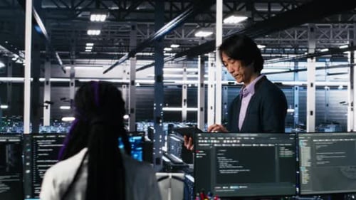 Two Men Working at Data Center Workstation