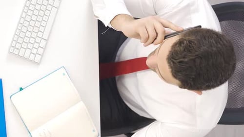 Vertical Video of Thoughtful businessman working in the office.