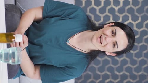 Smiling Woman Clapping Hands and Giving Thumbs Up