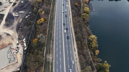 Aerial View of Cars Driving Along Highway