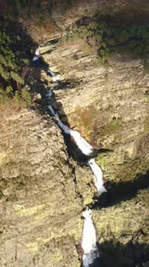 Aerial View of River Waterfall in the Mountains Aerial View