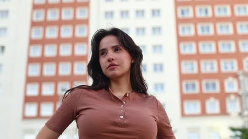 Woman Posing Outside in Urban Setting