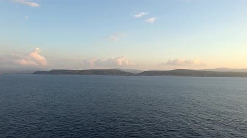 Island view in the distance from the ocean.