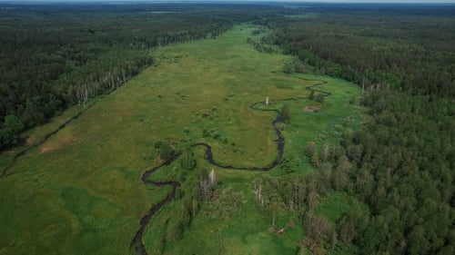 Aerial View of Stunning Beautiful Landscape with Valley with Small Winding River and Forest to