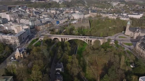 Stunning Aerial View of Luxembourg City Showcasing Its Historic Bridge Pont Adolphe Green Parks and
