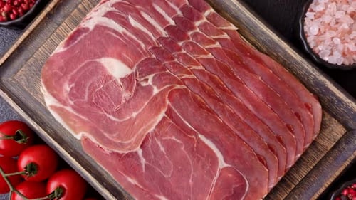 Meat, ham, jamon, or prosciutto sliced for breakfast bruschetta. Sliced ham, jamon, or prosciutto