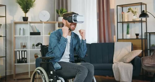 Man in Wheelchair Experiencing VR with Enthusiasm