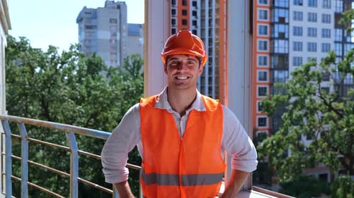 Cheerful Construction Worker Smiling on Urban Building Site