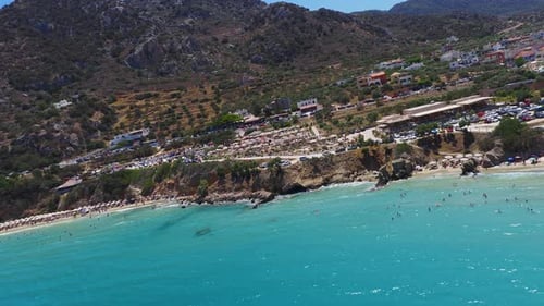 Aerial View of Voulisma Beach with Turquoise Waters and Hills