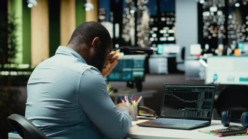 Worried Finance Advisor Seeing the Forex Trends Downward and Losing Money