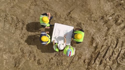 Planning the Future Aerial of Engineers and Architects on Construction Site