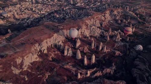 Aerial view of Cappadocia's fairy chimneys and hot air balloons