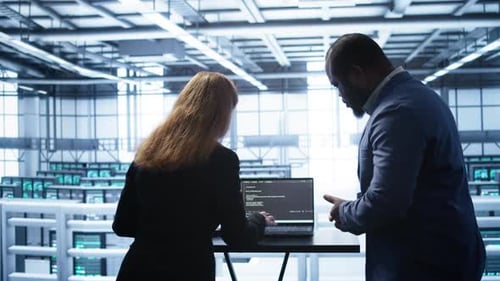 IT Support Staff Members in Server Hub Monitoring Server Infrastructure